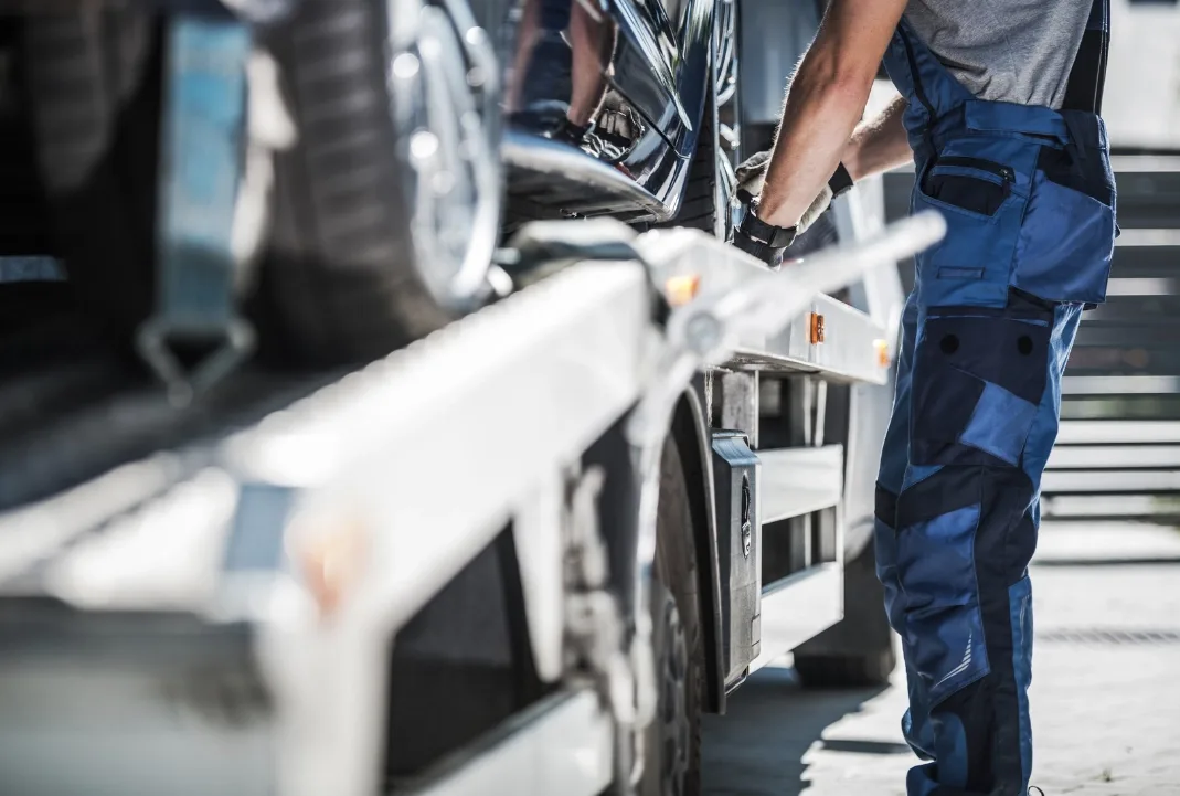 st. Louis tow truck driver loading a car onto a flatbed